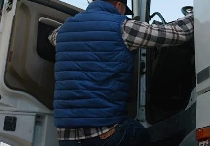 Truck driver entering truck 1